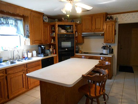 Kitchen view  with hall to laundry room and exit into garage.