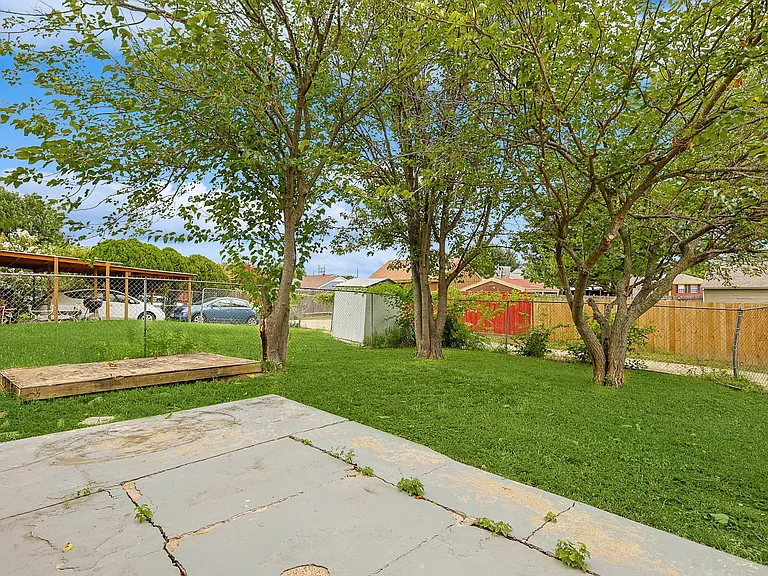 A view of the fully-fenced backyard of the property.