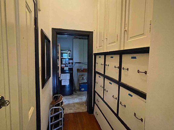 Hallway and floor-to-ceiling built-ins