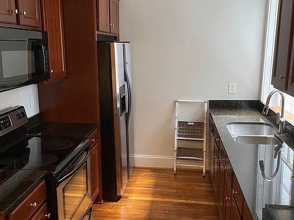Kitchen. Notice the granite countertops and window behind the sink.