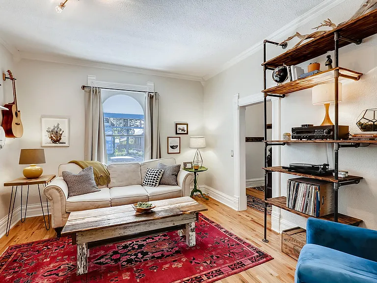Living room w/ custom shelving included