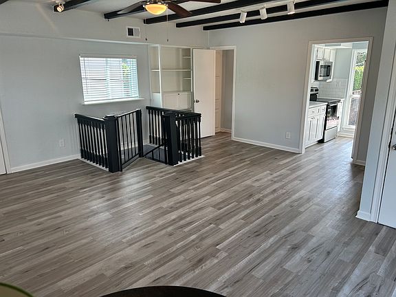 Large living and dining area that could double as a studio-apartment bedroom.