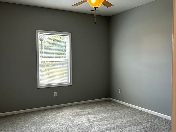 Master bedroom with fresh new carpet installed with ceiling fan