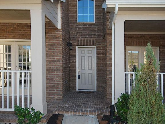 Covered two story entry features French door access to the covered patios from the formal living and study areas