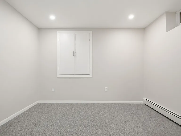 Office / Study with recessed lighting (on dimmer switch) and sliding French doors for privacy