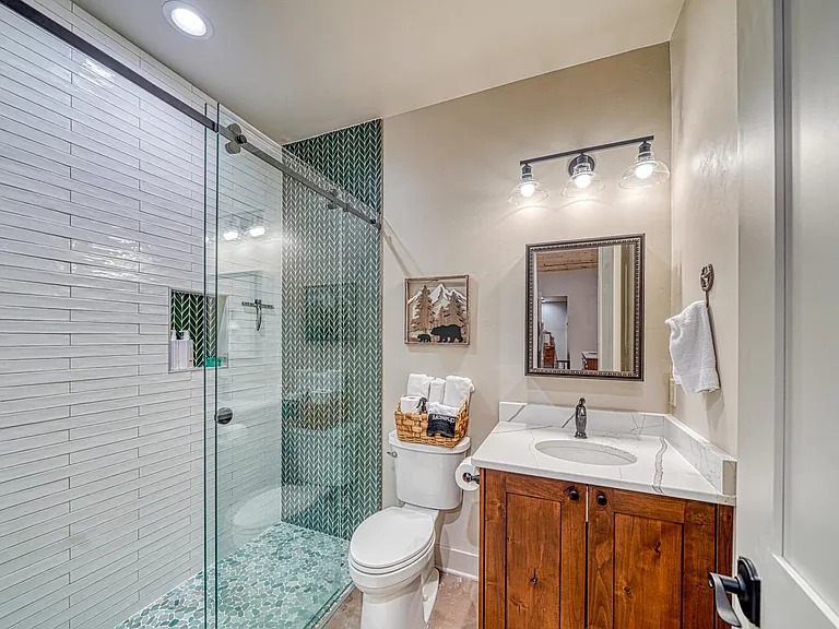 Modern 3/4 bathroom just steps away from the Pine Tree Room.