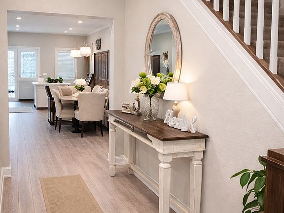 Welcoming entry with high ceilings, natural light, and open sightlines into the main living space.
