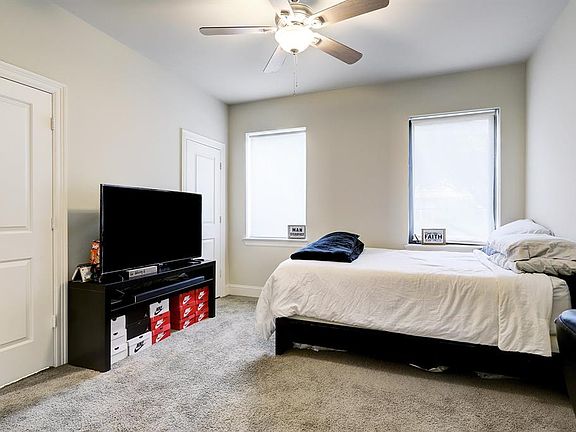 The downstairs bedroom has a large closet and an en-suite bathroom.