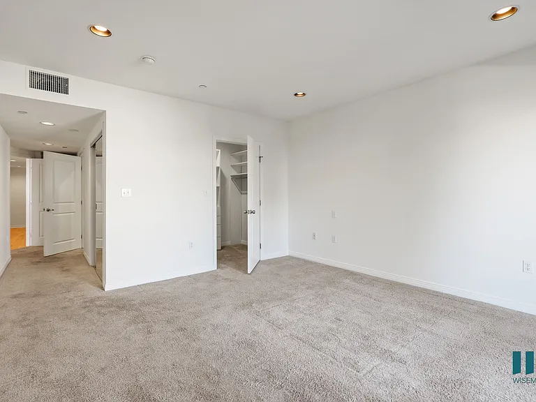 Bedroom withWalk-In Closet, Carpet, and Recessed Lighting