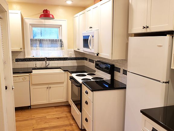 Fully applianced kitchen. Sink has Insinkerator hot water unit.