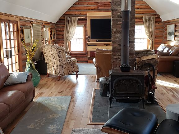 Log cabin living room with 70" Samsung Smart TV