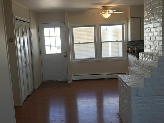 Fireplace and entry by kitchen