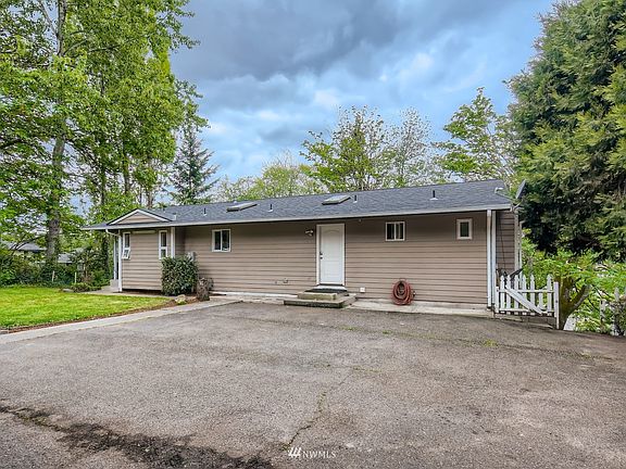 The second entrance to the right of the house>