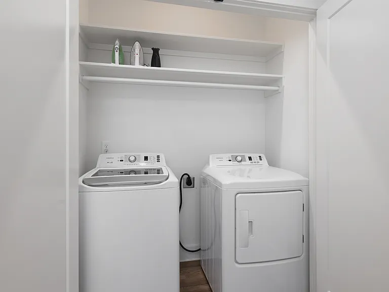 Washer + dryer located in the hall for your convenience.
