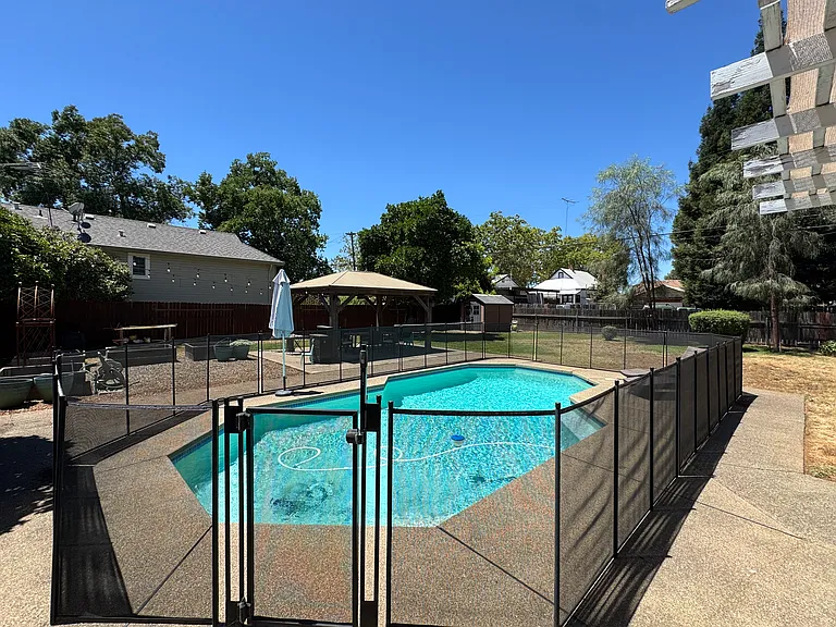 Pool with gated fence