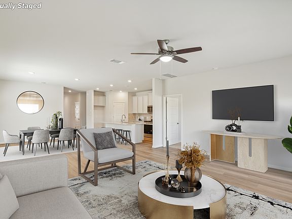 Virtually staged living room in the Reynolds floorplan at a Meritage Homes community.