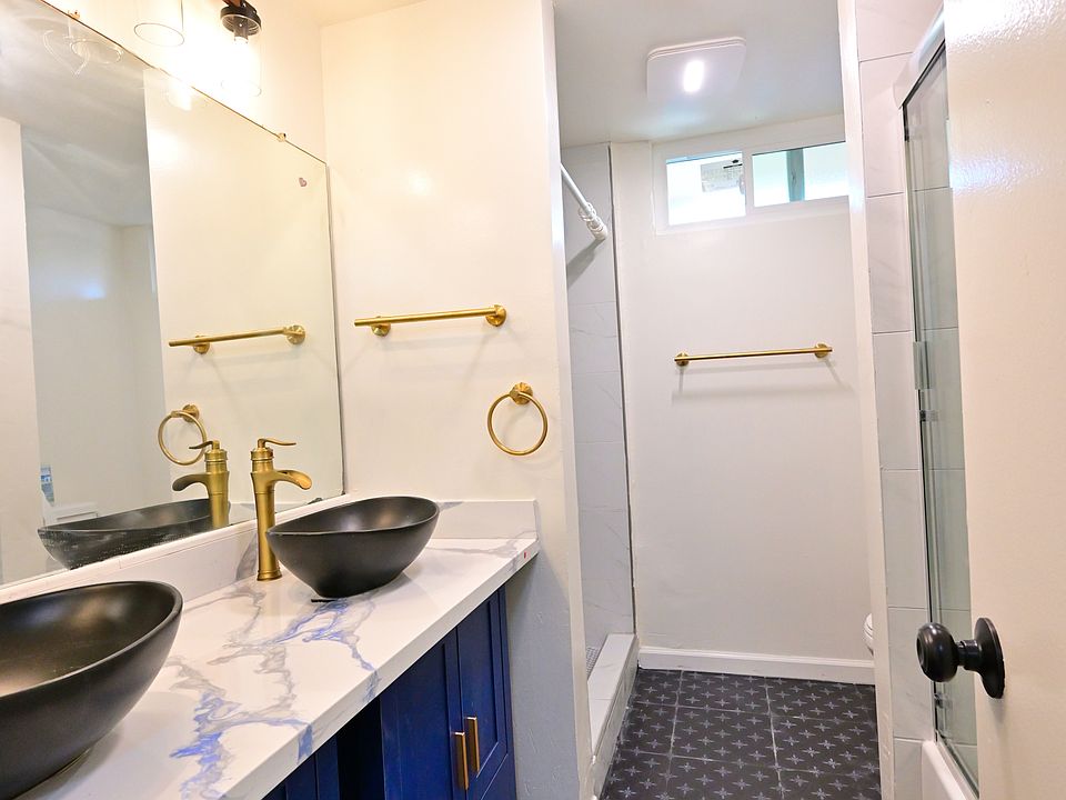 beautifully upgraded bathroom (bathtub and shower stall!) with dual sinks!