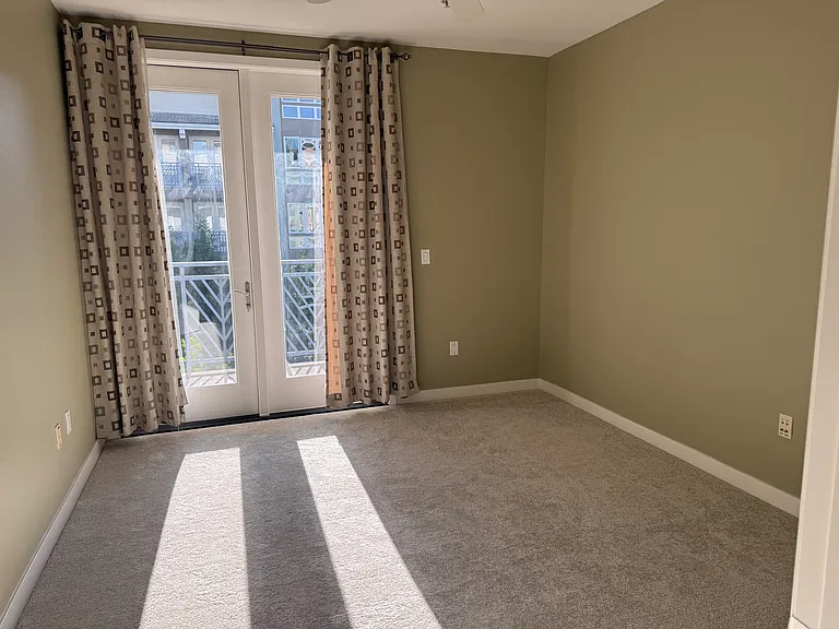 Main bed room with blackout curtains, Walk-in closet with custom shelving.