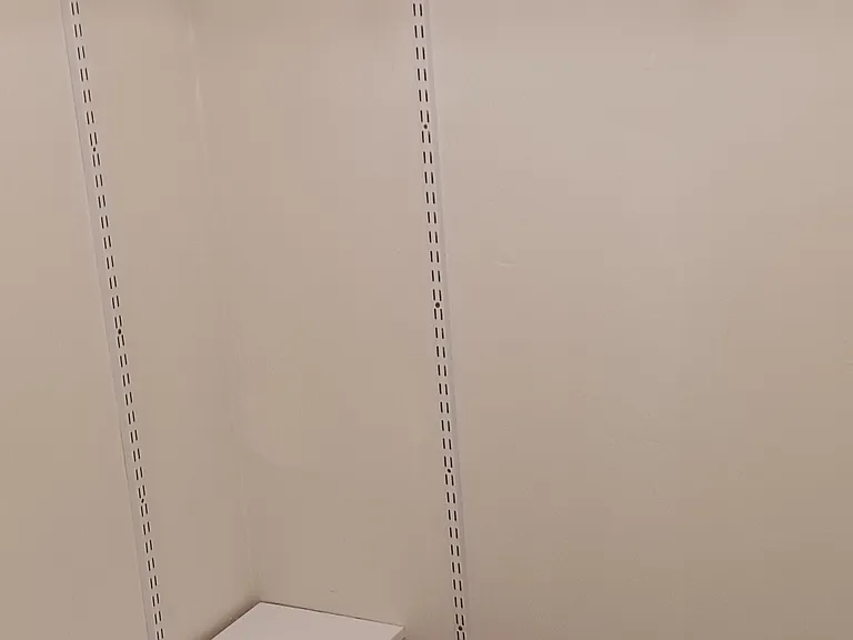 Main bedroom walk in closet with adjustable shelves