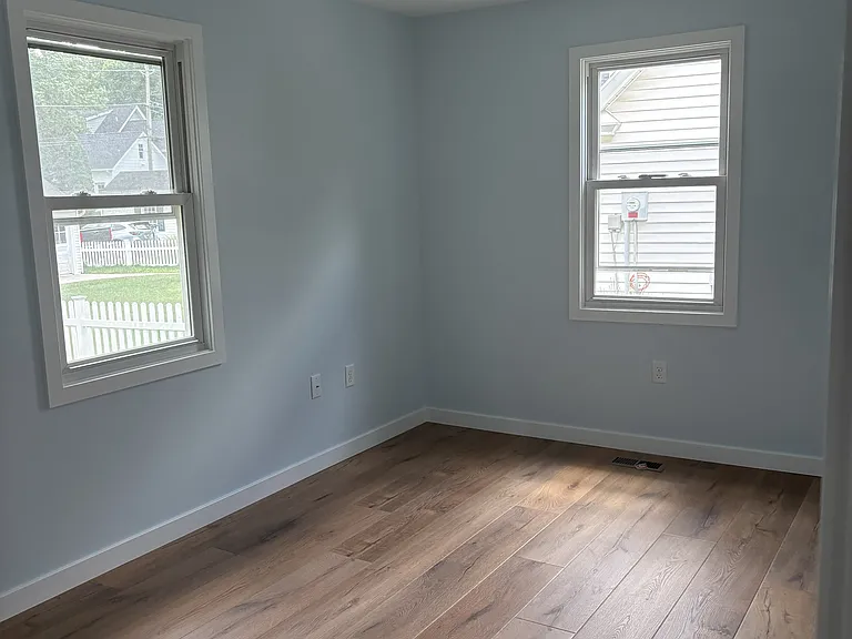 Bedroom with fan and light
