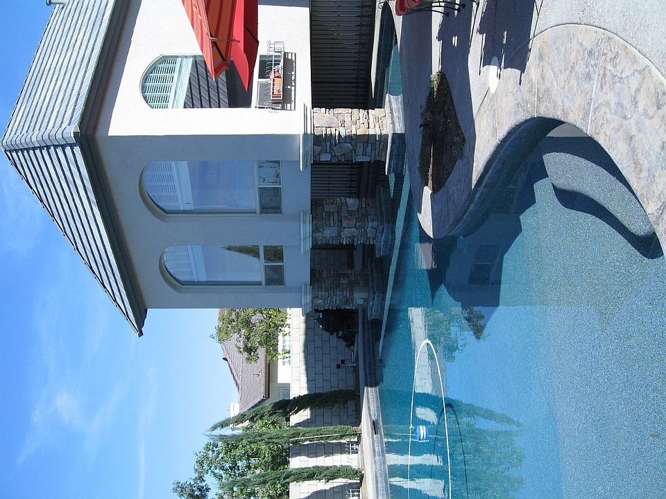 Library over pool with glass floor