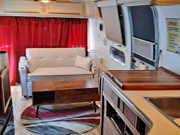 living area/kitchen with sleeper loveseat.