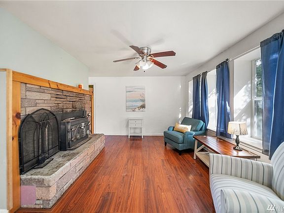 Cozy living room with wood fireplace.