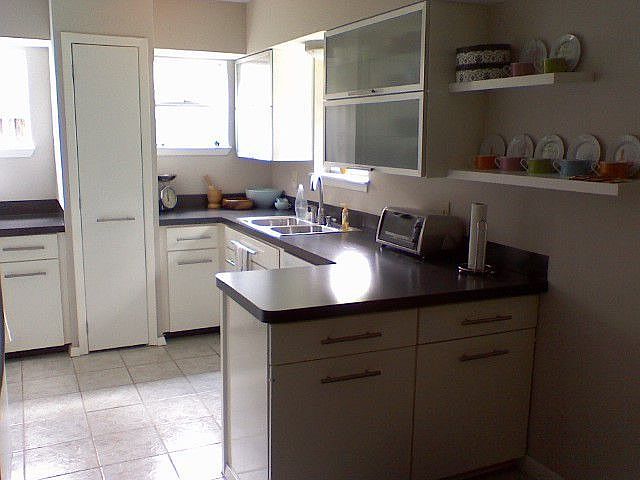 Kitchen with frosted vertical cabinets