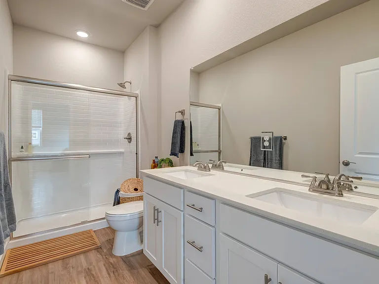 Dual-sink vanities in primary bathroom