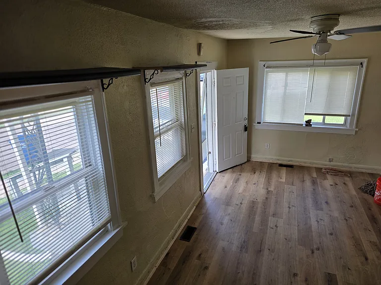 Roomy family size living room with tons of energy windows