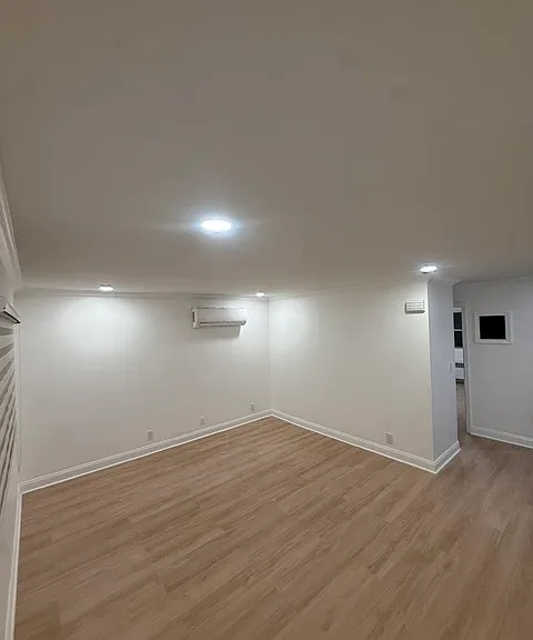 Spacious living room with recessed lighting & mini split heating/cooling