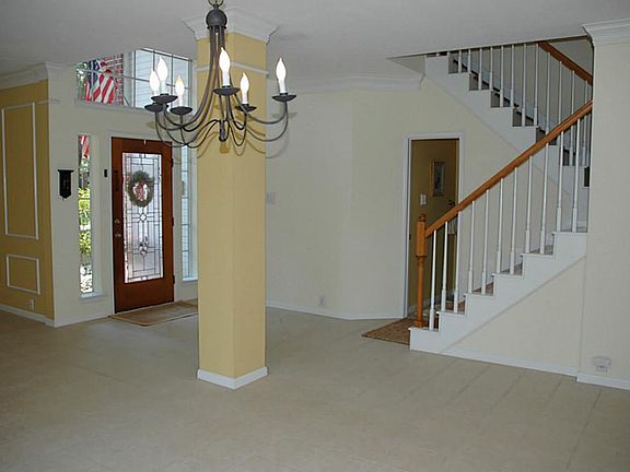 Lovely two story entry with tile floor and custom paint.