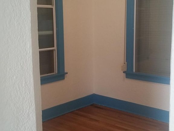Original oak hardwood floors thoughout recently refinished. This is the dining room.