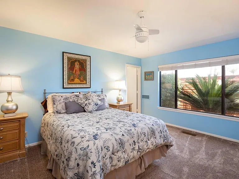 Second master with king bed and attached bathroom.