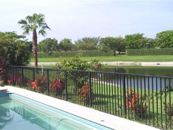 Lap pool, fenced in grass area for play or pets