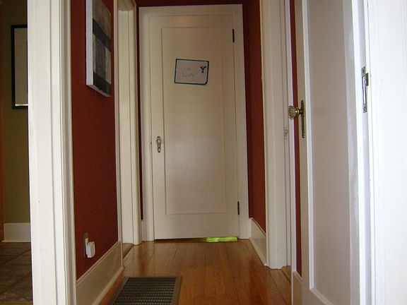 Hallway btwn. main floor bdrms. Full bathh on right.