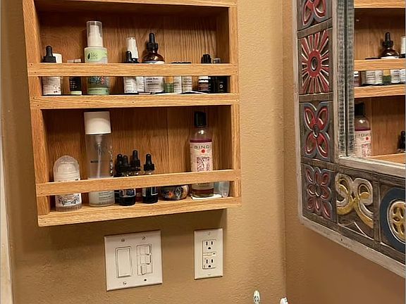 handmade apothecary shelf in upstairs bathroom