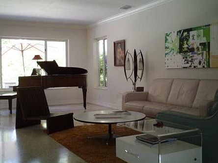 Large open living area. House is being freshly painted for