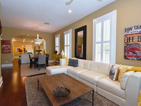 Stepping into the home is warm and inviting. 10 foot ceilings give an even more spacious feel, as do the tall windows.