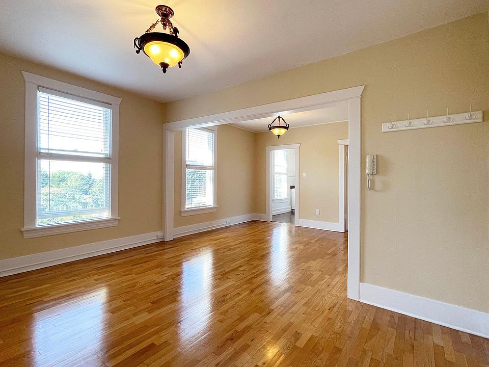 Open Archway from Living to Dining. Security Intercom with Front Door Release.