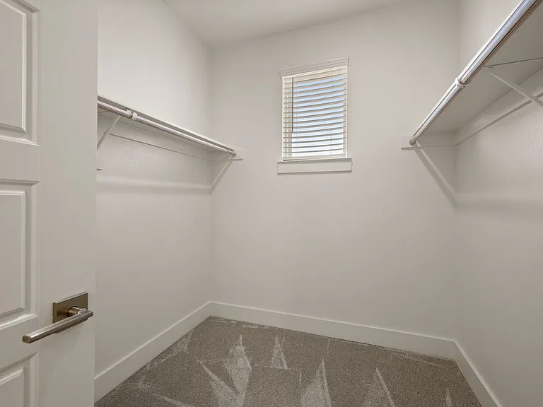 Master bedroom walk-in closet off the en suite master full bathroom