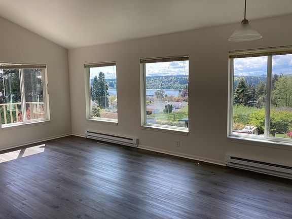 Living room with vaulted ceilings and lovely views.