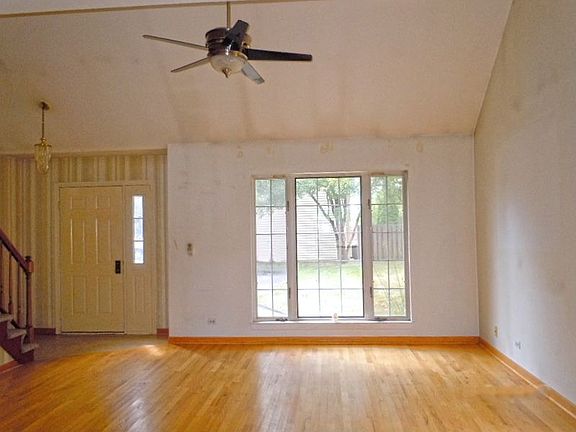 View of Living Room with Vaulted Ceilings and Nice Panned Window