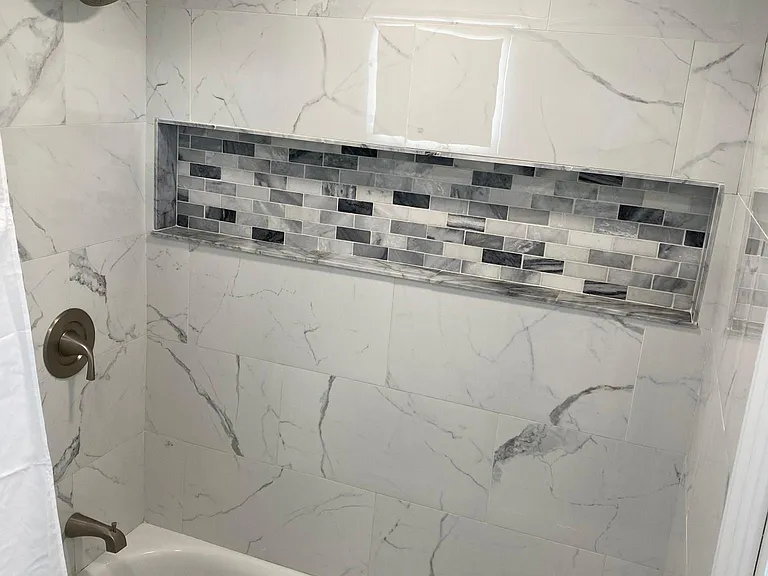 Updated bathroom tile and shower finishes.