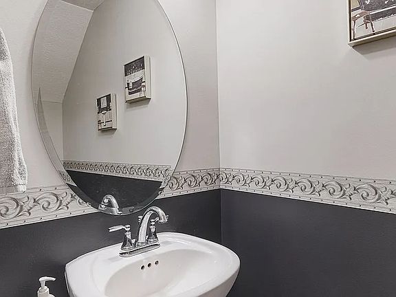 When you enter, you will see a storage space and a half bathroom on the left