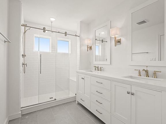 Primary bath with glass shower enclosure