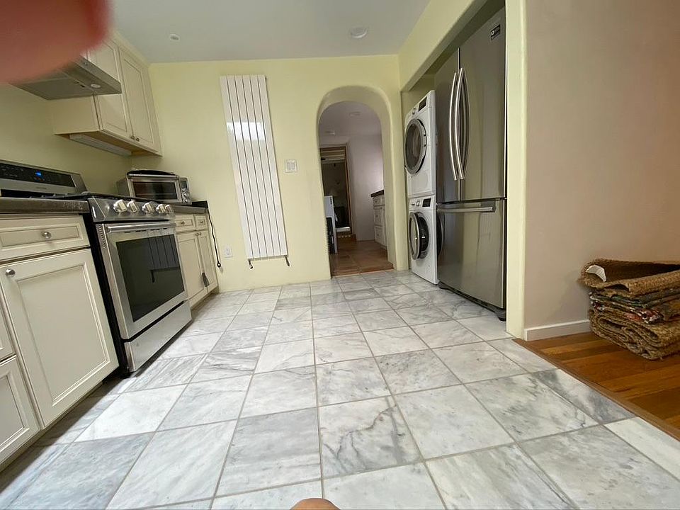 From kitchen sink looking towards alternative entry, bath, and bedroom