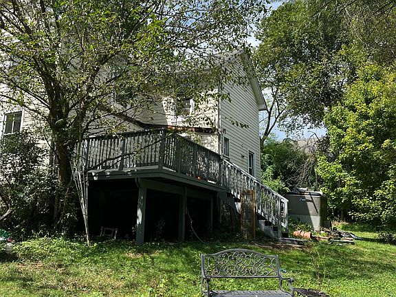Back view of deck and bench by pond