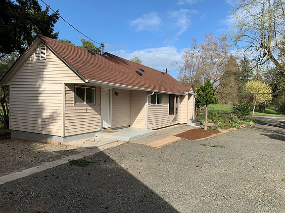 House looking east. Large front yard beyond house
