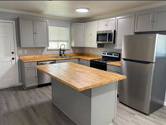 Brand new kitchen with island (breakfast bar) and new appliances.